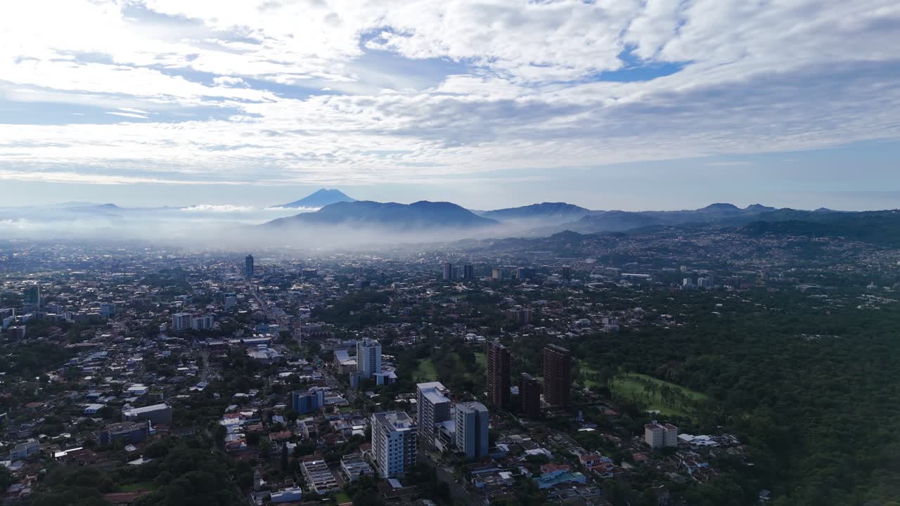 Aerial view of the city with mountains in the background